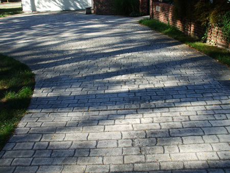 Residential stamped concrete driveway in Jackson, Michigan.