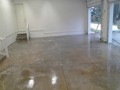 Stained concrete with epoxy coating in a Jackson, Michigan residential garage.